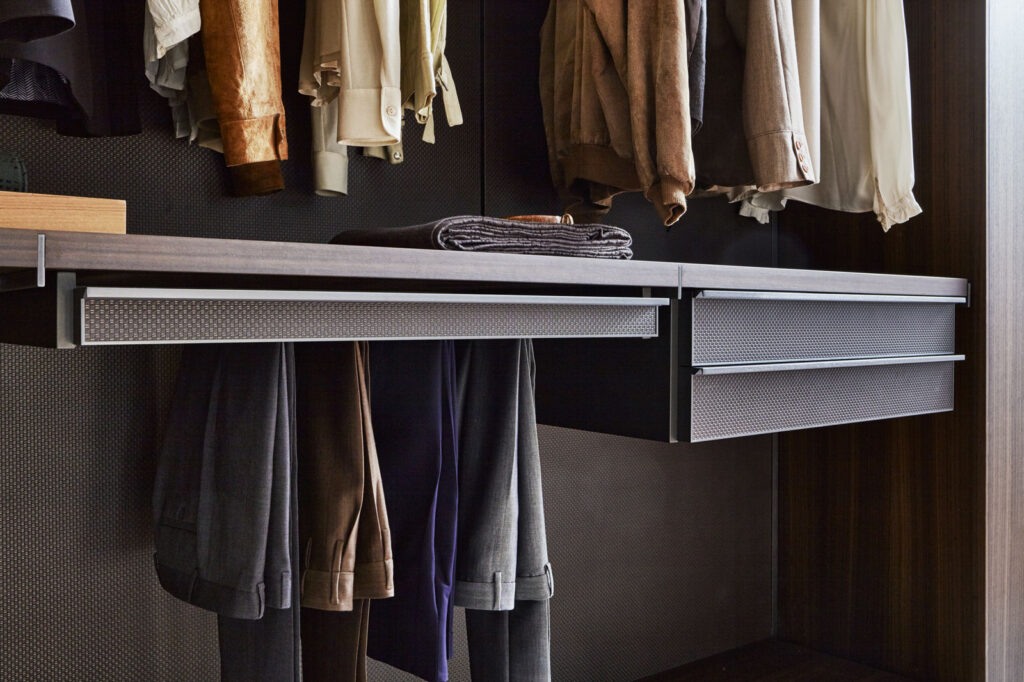Well-spaced clothing racks in Walk in Closet