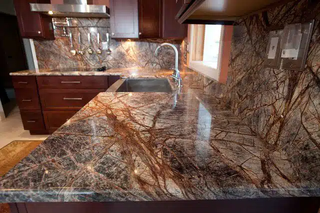 Brown Marble Kitchen Countertop Color Ideas: Brown marble kitchen countertops exude warmth and richness, offering a versatile option that complements a wide range of decor styles.