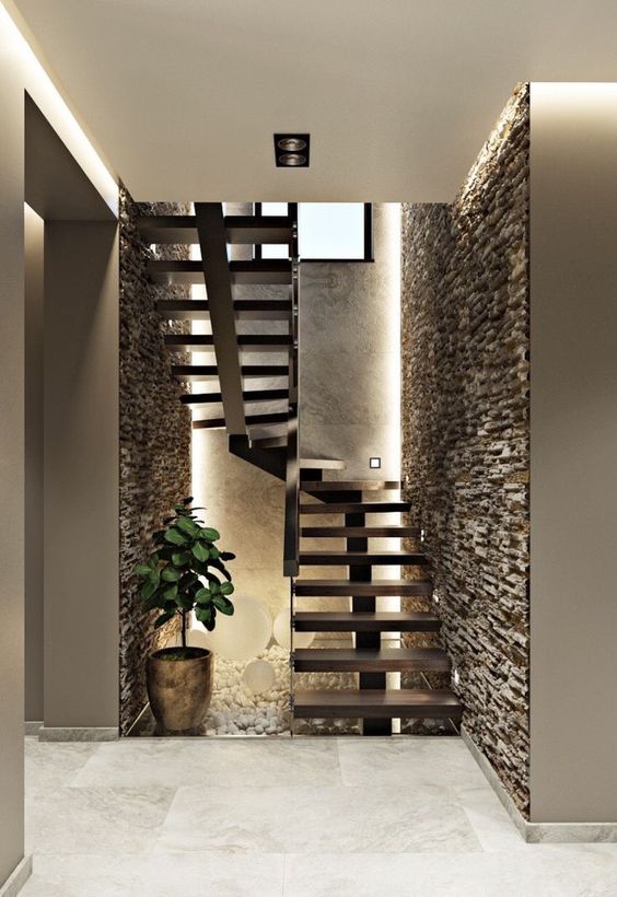 Textured Stone Wall Staircase Wall Design along wooden staircase