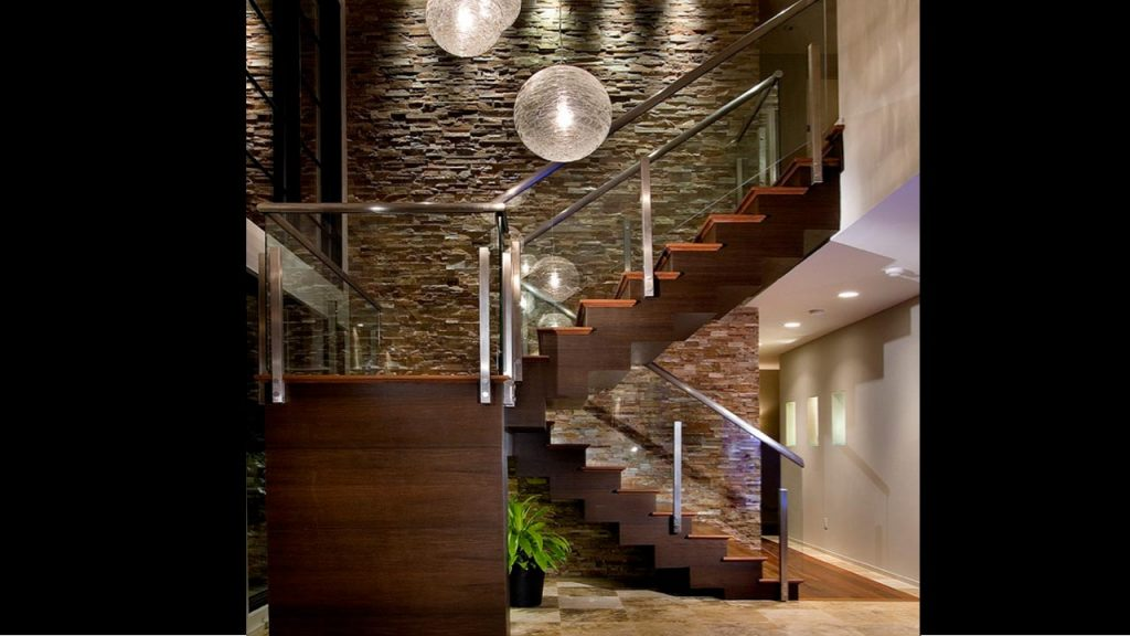 Textured Stone Wall Staircase Wall Design with ambient lighting